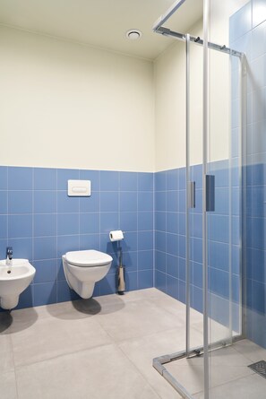 Shower, eco-friendly toiletries, towels, soap