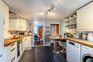 Oven, dishwasher, high chair, cookware/dishes/utensils