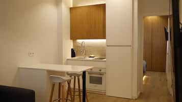 Superior Apartment | Private kitchen | Full-sized fridge, microwave, oven, stovetop