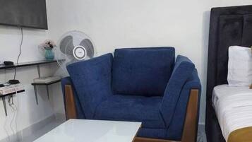 Classic Studio, City View | Living area | 24-inch Smart TV with digital channels