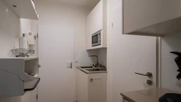 Fridge, coffee/tea maker, toaster, cookware/dishes/utensils
