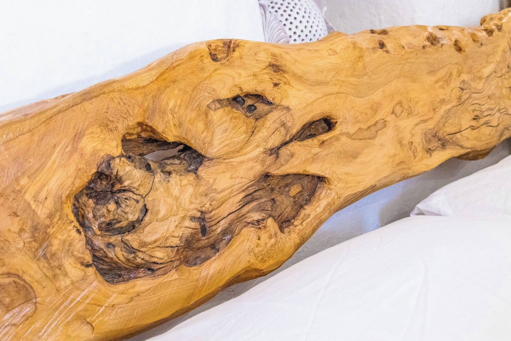 A wooden sculpture with natural textures and patterns.