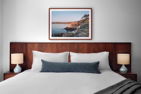 Premium bedding, pillow-top beds, desk, laptop workspace