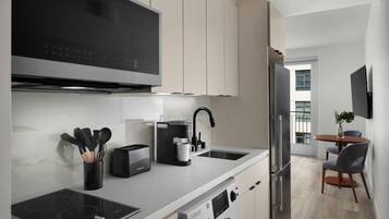 Queen Signature Suite with View | Private kitchen | Full-size fridge, microwave, stovetop, coffee/tea maker