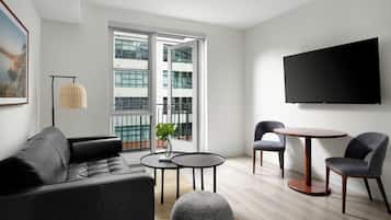 Deluxe Balcony Suite | Living area | 55-inch flat-screen TV with cable channels, Netflix, Hulu