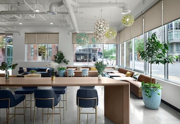 A multi-story residential building with balconies, large windows, and a modern architectural design. at The Margot Hotel San Diego Gaslamp Quarter, Outset by Hilton