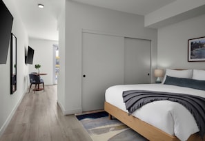 Premium bedding, pillow-top beds, desk, laptop workspace