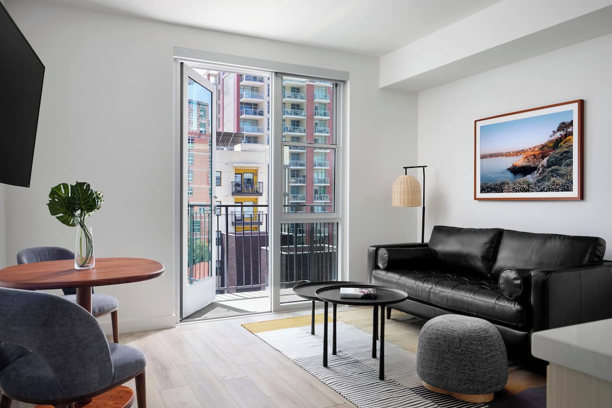 Deluxe Balcony Suite | Living area | 55-inch flat-screen TV with cable channels, Netflix, Hulu