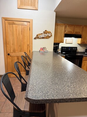 Fridge, microwave, oven, stovetop - Trailhead Riverfront Cabin (McCarr)