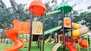 A playground with multiple slides and climbing structures. - Spacious, Peaceful 2BD, Mamad, Garden, Parking near Kfar Sava (Gan Haim)