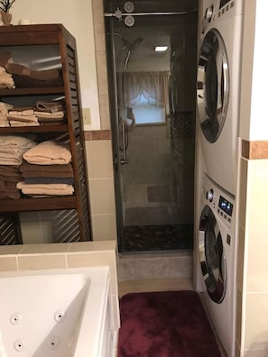 Shower, jetted tub, hair dryer, towels