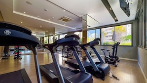A gym with treadmills, stationary bikes, and weights. - Vitralli  (Sao Paulo)