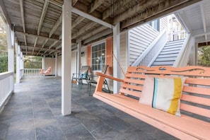 Relax in a serene outdoor space with comfortable seating and a secure, elevated area.