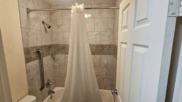 Combined shower/tub, hair dryer, towels, soap
