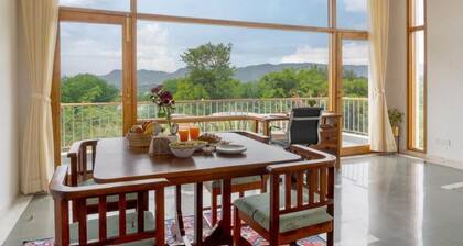 Two-bedroom boutique homestay with a serene view of Lake Lakhawali and Aravalis.