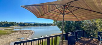 Serene lakefront home w/ free attraction tickets, dock, game room, & fire pit