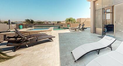 Luxury home with a pool, spa, fireplace, & private gas grill