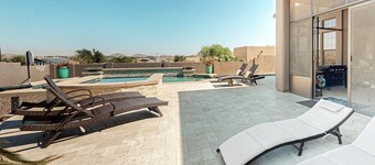 Luxury home with a pool, spa, fireplace, & private gas grill