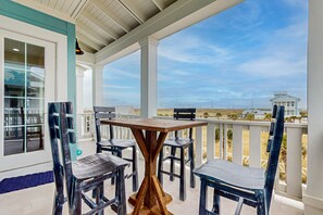 Outdoor dining - Gorgeous home with ocean views, balconies, elevator & pond - steps from beach! (Port Aransas)