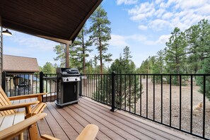 Enjoy al fresco dining on the deck overlooking the forest, where you can barbecue and relax in the peaceful surroundings.