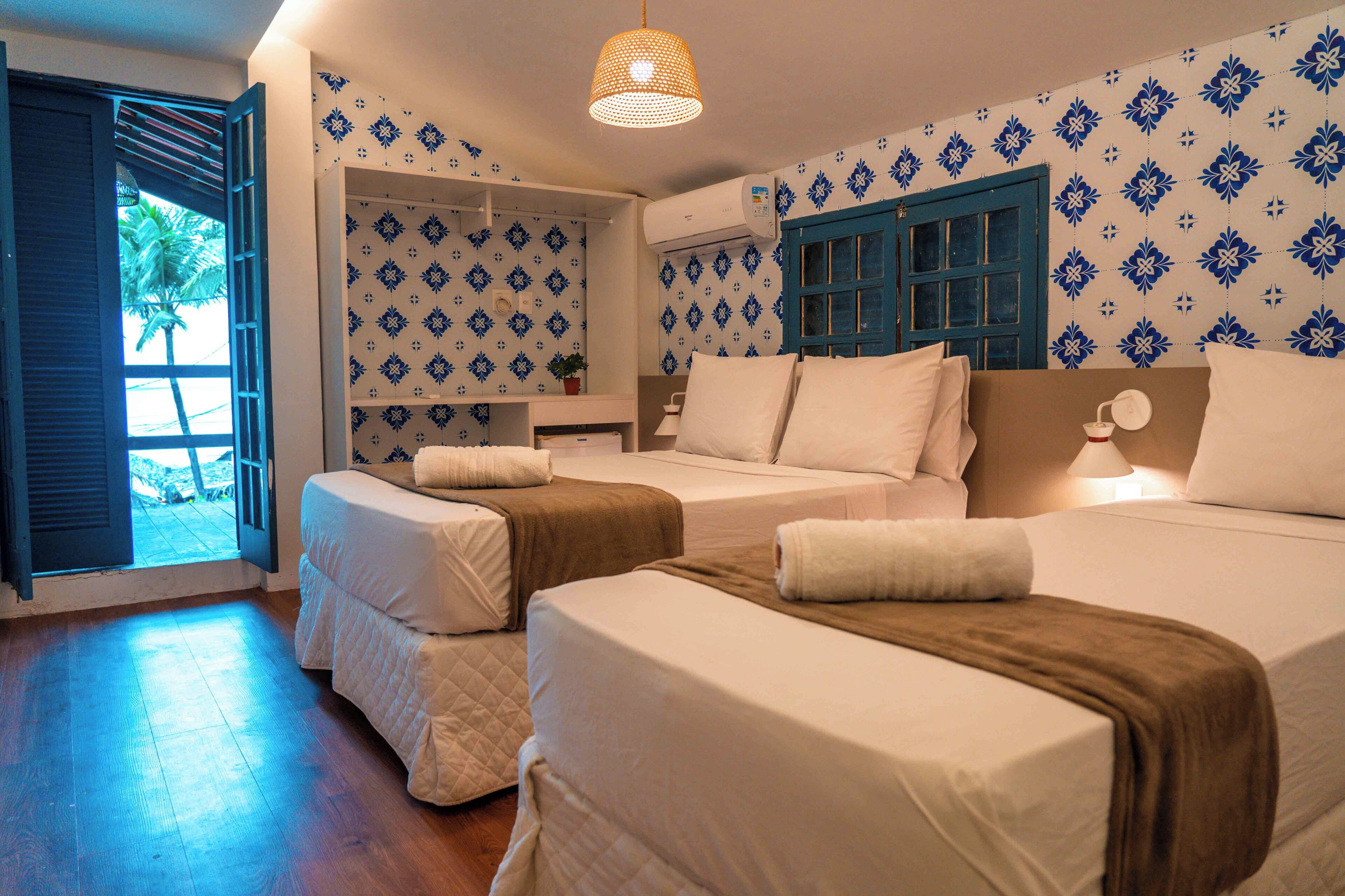 Quarto triplo luxo, vista para a praia (PORTOFINO) | Wi-Fi de cortesia