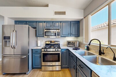 Updated home with private pool, enclosed yard, covered patio, grill, & W/D