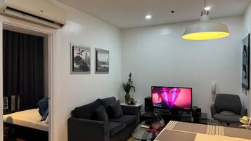 Family Double Room, Balcony, City View | Living area | TV