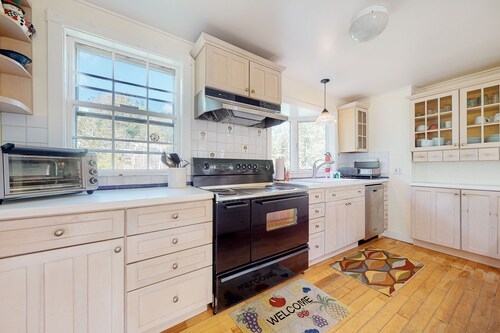 Delightful updated farmhouse with original features, patio, and & W/D