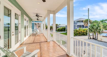 Water-view villa with sunset balconies, grill, & pool - walk to beach and dining