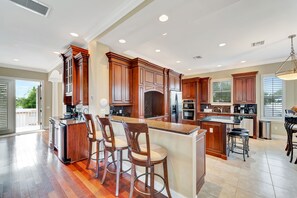 Fridge, microwave, oven, stovetop - Water-view villa with sunset balconies, grill, & pool - walk to beach and dining (Fort Myers Beach)