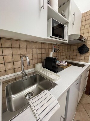 Fridge, microwave, stovetop, coffee/tea maker