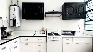 Fridge, microwave, stovetop, coffee/tea maker