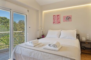 A hotel room with a bed, a nightstand, a window with a view, and two wall art pieces. - First Floor Bedroom 6 with Shared Terrace, Wi-Fi and Air Conditioning (????????S)