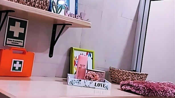 A shelf with woven baskets, a potted plant, and various decorative items.