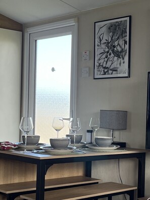 Dining - Cosy Caravan in a quiet corner of the site - with a beautiful sea view! (Minster on Sea)