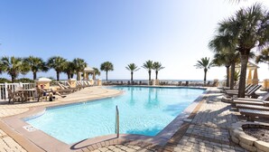 A swimming pool with lounge chairs and palm trees. - PRIVATE HOME, QUIET AREA, PERFECT GETAWAY (Gulf Shores)