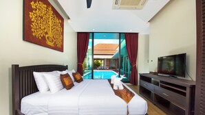 A modern hotel room with a large bed, a television, and a view of a swimming pool.