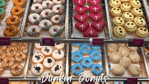 A bakery display with various decorated donuts. - Comfortable 6BR Urban Retreat Lgbtq 38 (Oklahoma City)