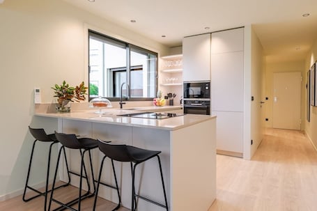 Fridge, microwave, oven, stovetop. Stylish Flat with Terrace & Garage by HostWise