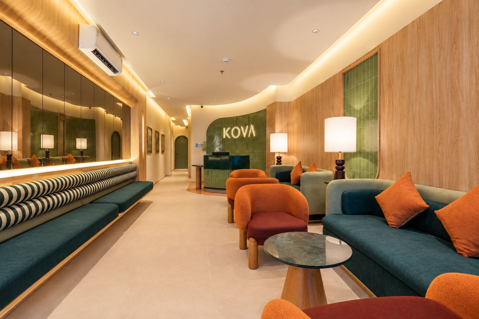 A modern hotel lobby with a reception desk, seating area, and a visible brand name 'KOVA'.
