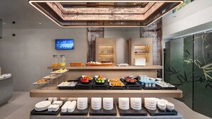 A modern breakfast buffet with various food items and dishes. - K.Space KaiShi hotel (Guangzhou)