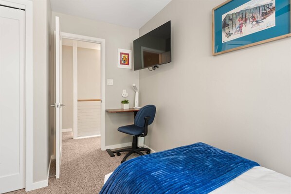 A TV and small desk make the second bedroom a good option if you need a quiet place to get some work done.