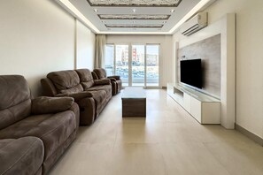 Basic Apartment | Living area | TV - Fresh & Fabulous 2bdr - 5 min to Airport (Cairo)