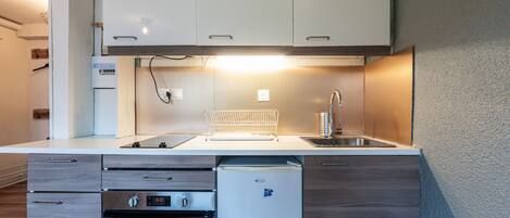 Fridge, microwave, cookware/dishes/utensils