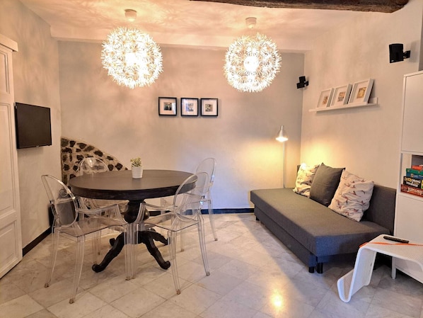 Standard Apartment | Living area | 32-inch flat-screen TV with digital channels