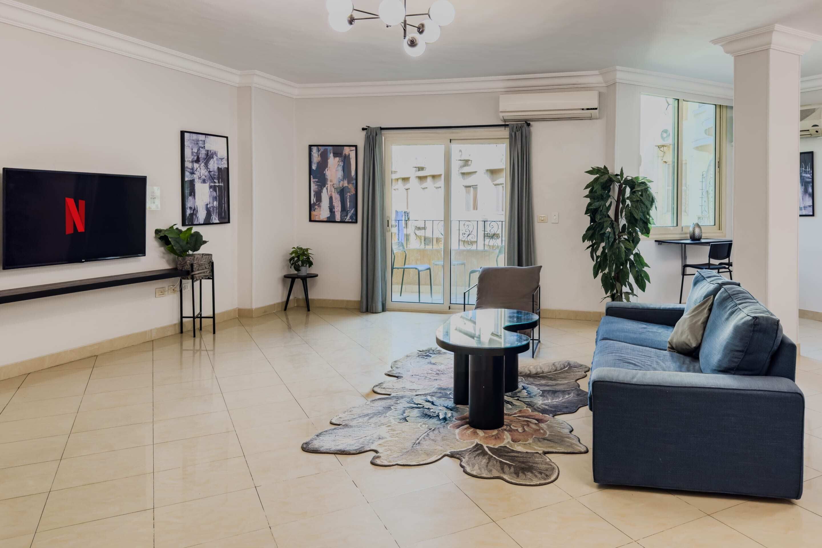 Basic Apartment (Distinct & Decent) | Living area | 55-inch Smart TV with satellite channels, streaming services