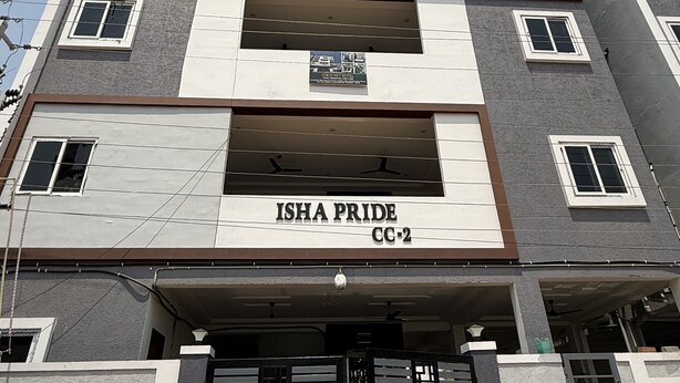 A multi-story building with a sign reading "ISHA PRIDE CC-2". - COCO NET Hotel (Ibrahimpatan)