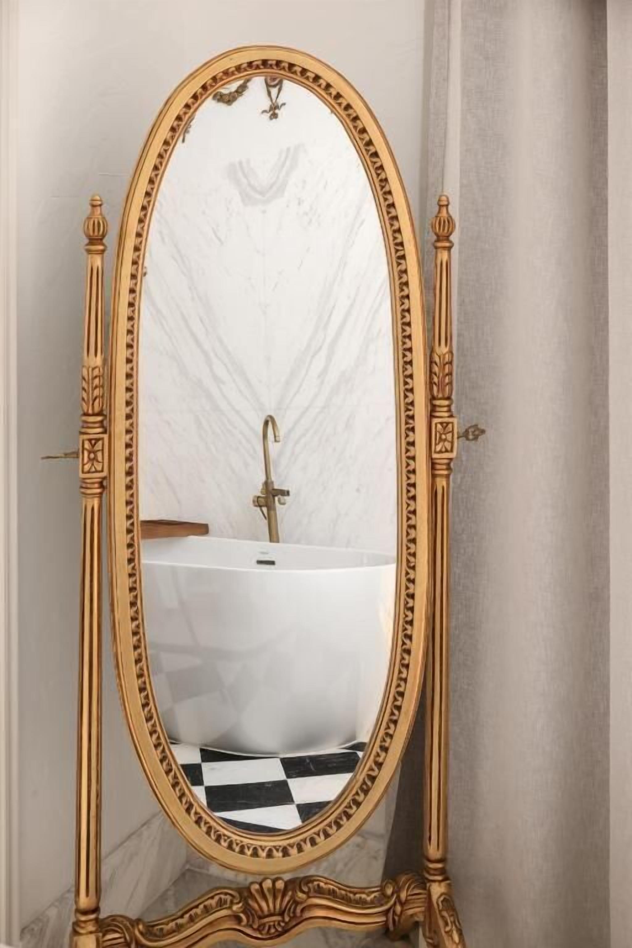 An ornate gold-framed mirror with a checkered floor pattern in the background.
