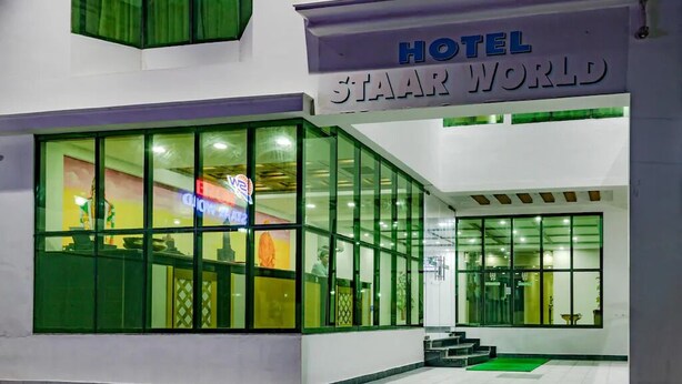 A hotel named 'STAAR WORLD' with large glass windows and a sign above the entrance. - HOTEL STAAR WORLD (Nagercoil)