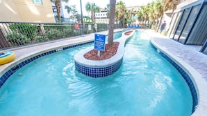 A swimming pool with a sign indicating no swimming in the lazy river. - Contemporary 2BR Beach Colony Resort, Pools, View (Myrtle Beach)